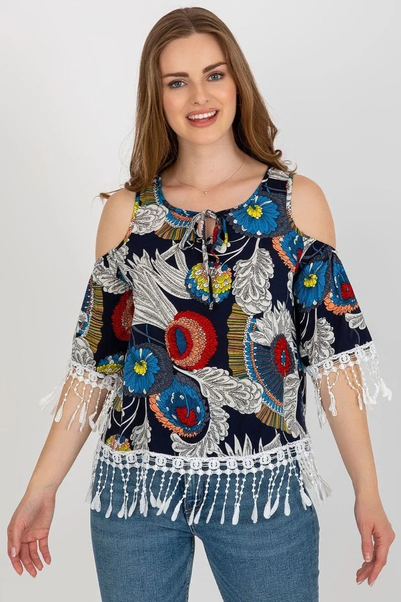 Navy blue cold-shoulder top with a vibrant floral print and white lace trim.