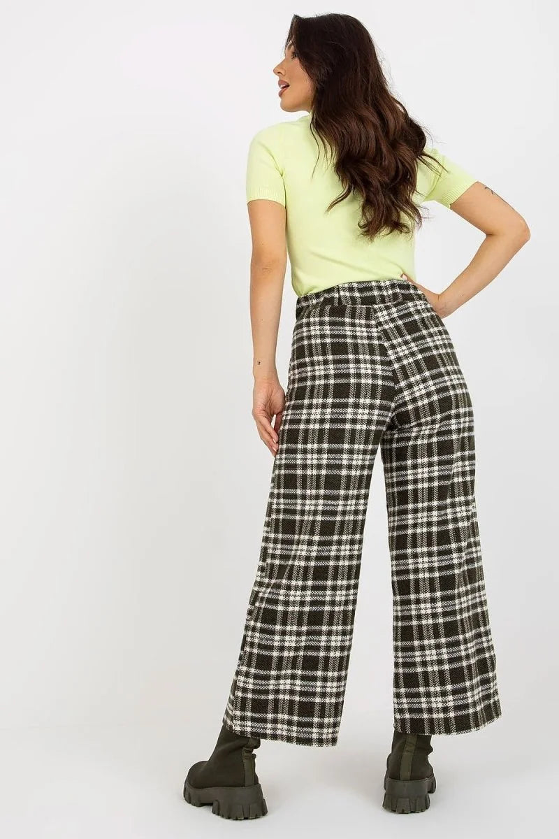 Khaki and white checkered wool pants with a relaxed fit, shown from the back on a model.