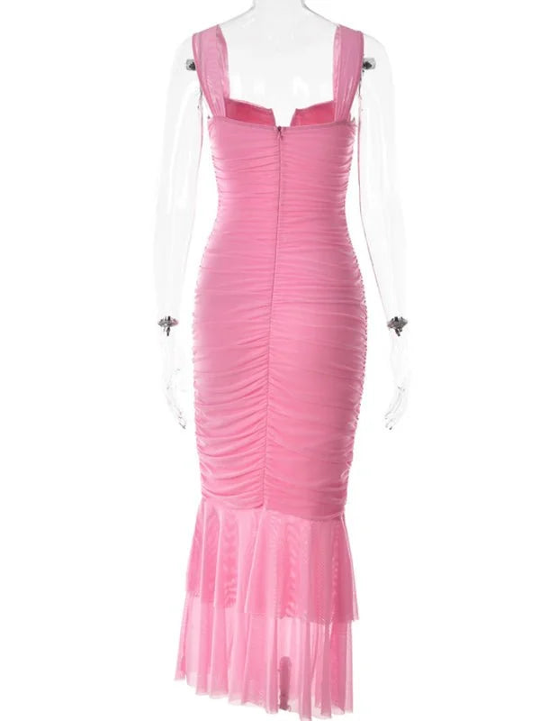 Back view of a ruched pink midi dress with a tiered mesh hem.