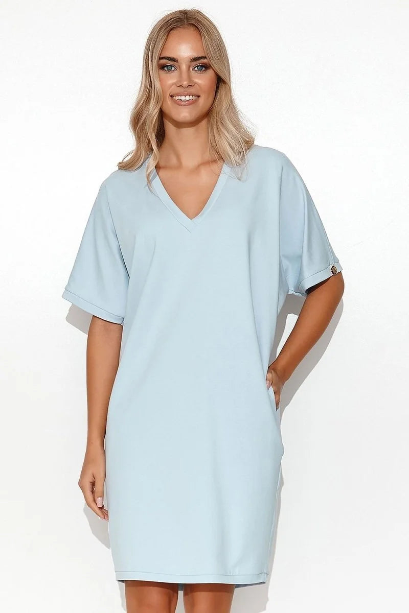 Light blue v-neck short-sleeve dress with pockets, on a model.