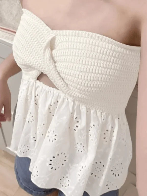 White smocked tube top with twisted detail and eyelet peplum hem.
