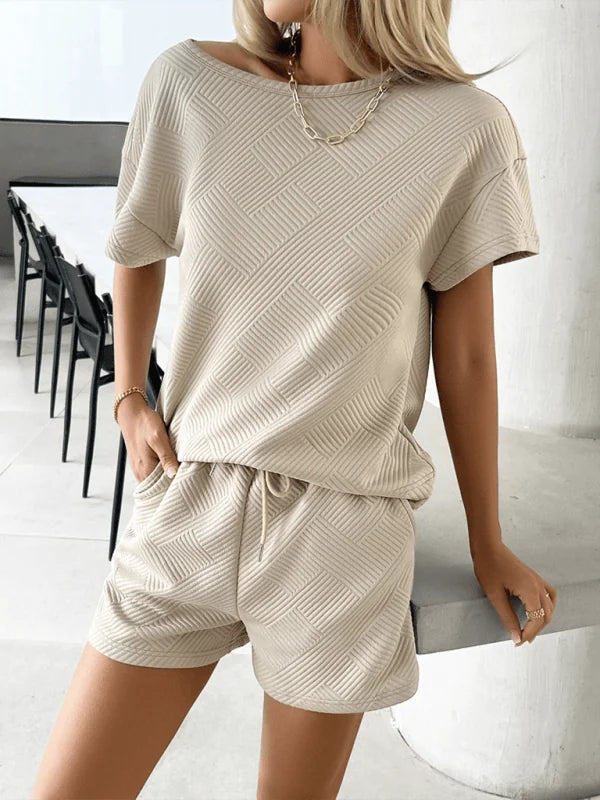 Light beige textured short suit with geometric pattern and drawstring shorts.
