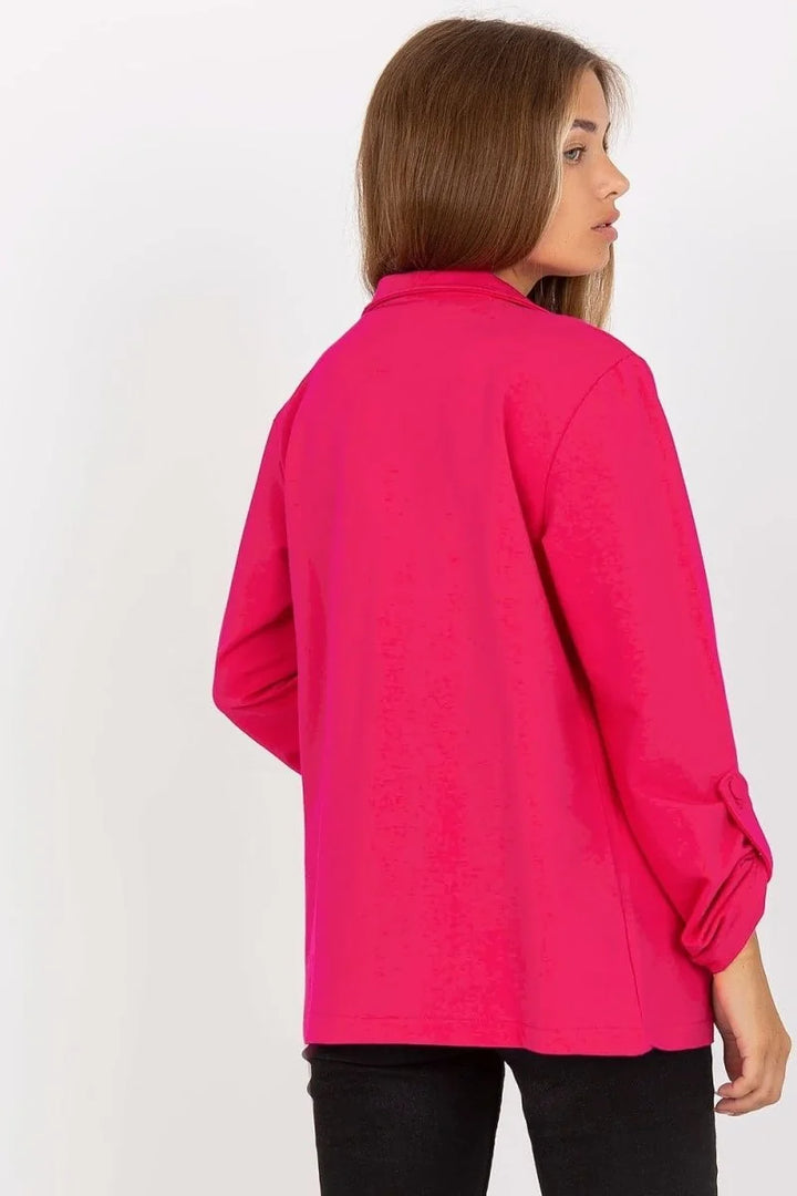 Bright pink long-sleeved blazer with rolled cuffs, shown from the back.