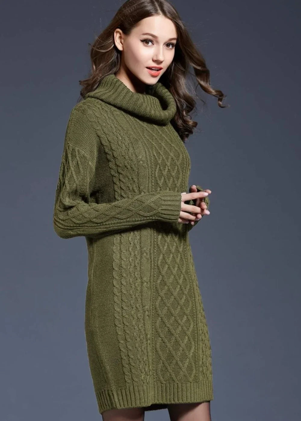 Green cable knit turtleneck sweater dress with long sleeves on a model.