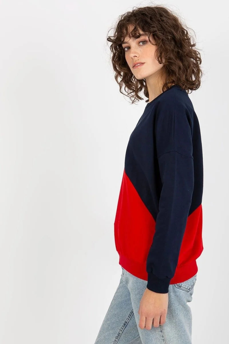 Navy blue and red color-blocked sweatshirt with a crew neck and long sleeves, shown on a model.
