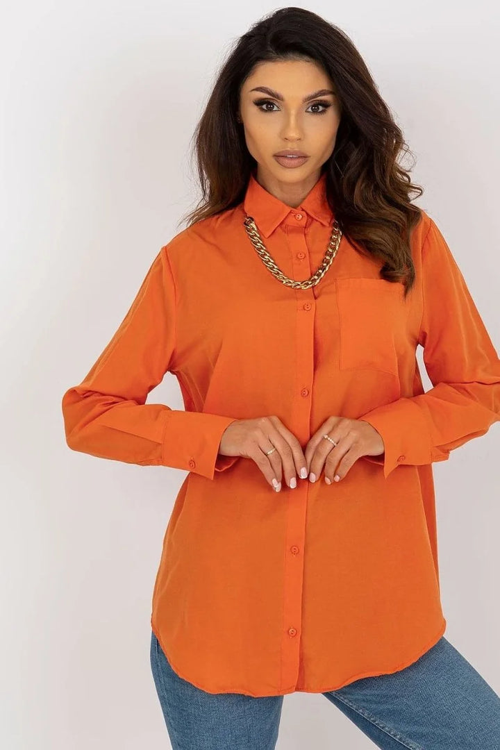 Orange oversized collared shirt with gold chain detail and button-up front.