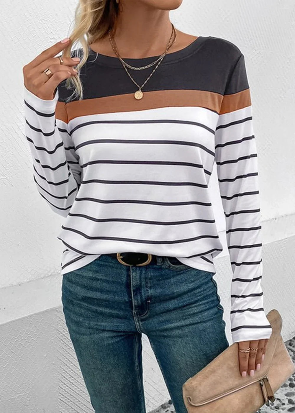 Striped long-sleeve top with brown and charcoal color blocking.