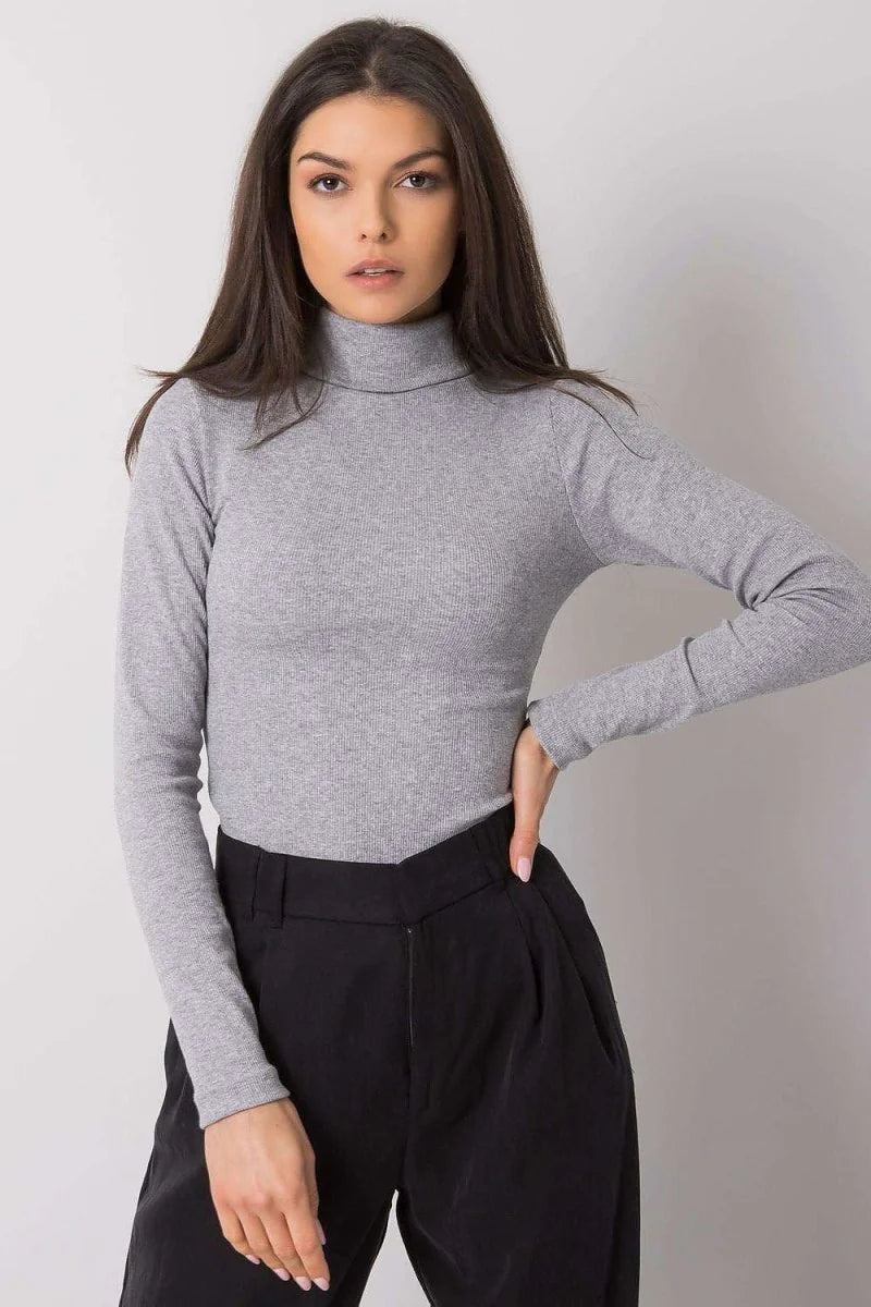 Light grey ribbed turtleneck top with long sleeves, fitted cut, on a model.