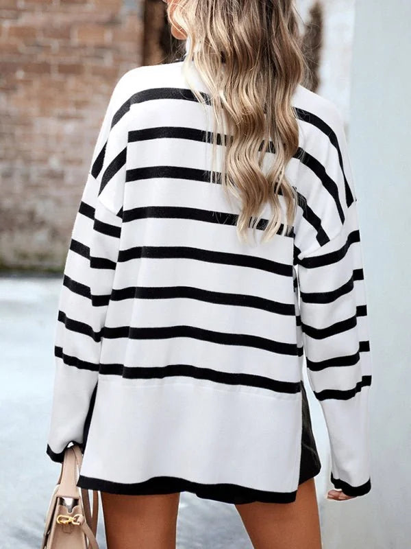 Black and white striped sweater with long sleeves, shown from the back on a model.
