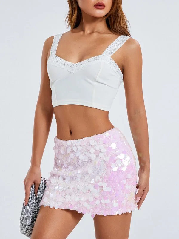 Pink sequin mini skirt with a slight shimmer, shown on model.