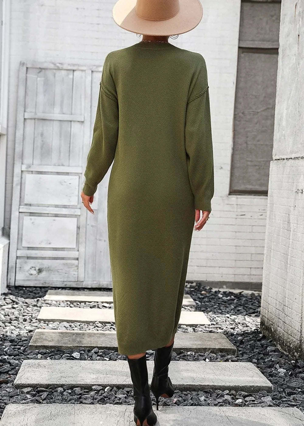 Olive green knit midi dress with long sleeves, worn by a model from behind.
