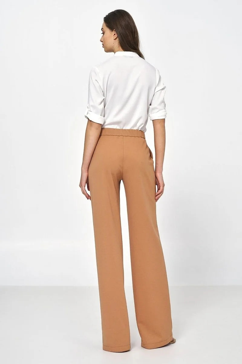 Back view of women's relaxed fit, tan wide-leg pants in a smooth fabric.