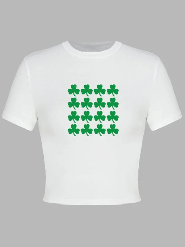 White cropped t-shirt with a repeating pattern of green shamrocks.