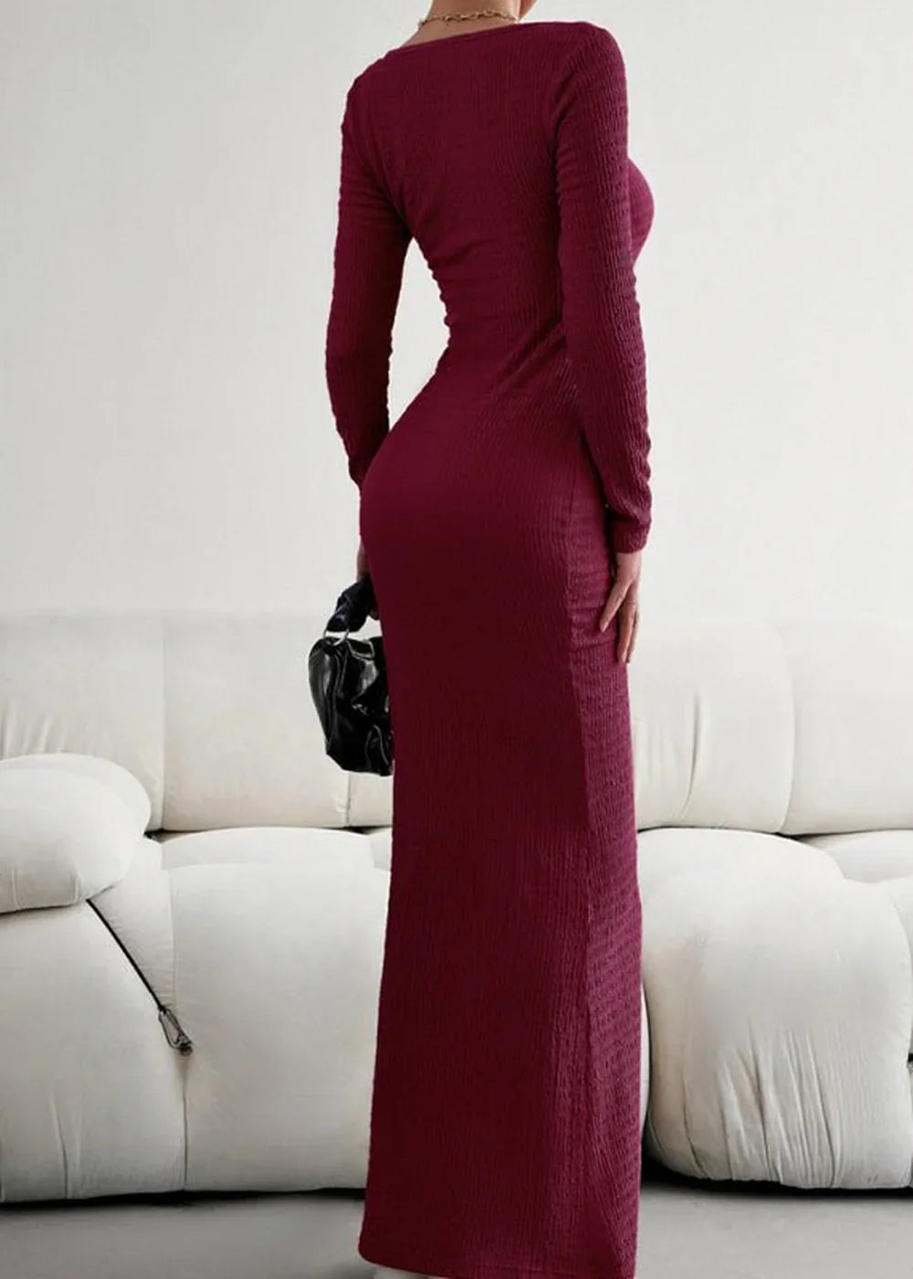 Deep burgundy ribbed maxi dress with long sleeves and a flattering fitted silhouette.