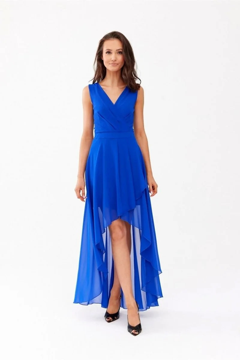 Royal blue high-low chiffon dress with a V-neck and ruffled hem, worn by a woman in black heels.