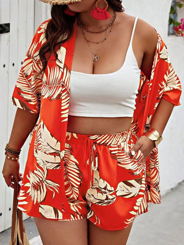 Orange leaf print shorts and matching open-front kimono with white crop top.