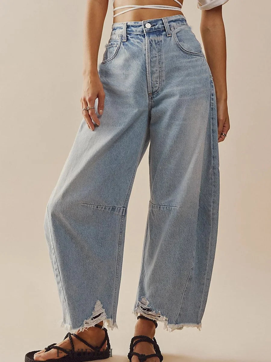 Light wash, high-waisted wide-leg jeans with frayed hems and distressed accents.