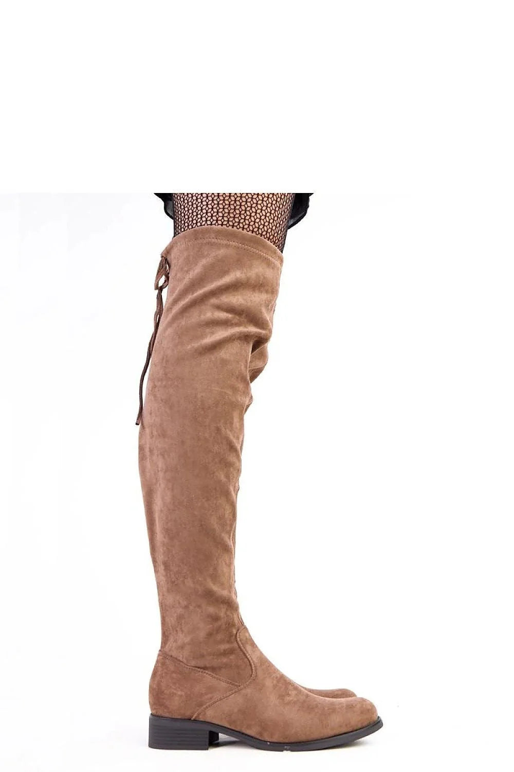 Close-up of a brown suede thigh-high boot with a tie detail on the back, worn with fishnet stockings.
