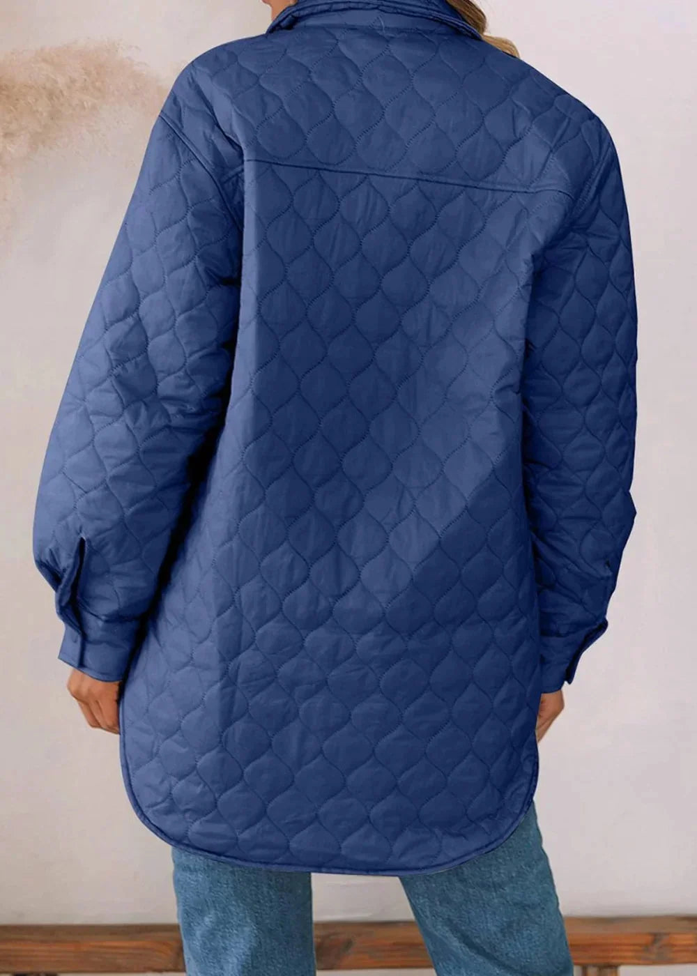 Navy blue quilted shacket with a regular fit, shown from the back.