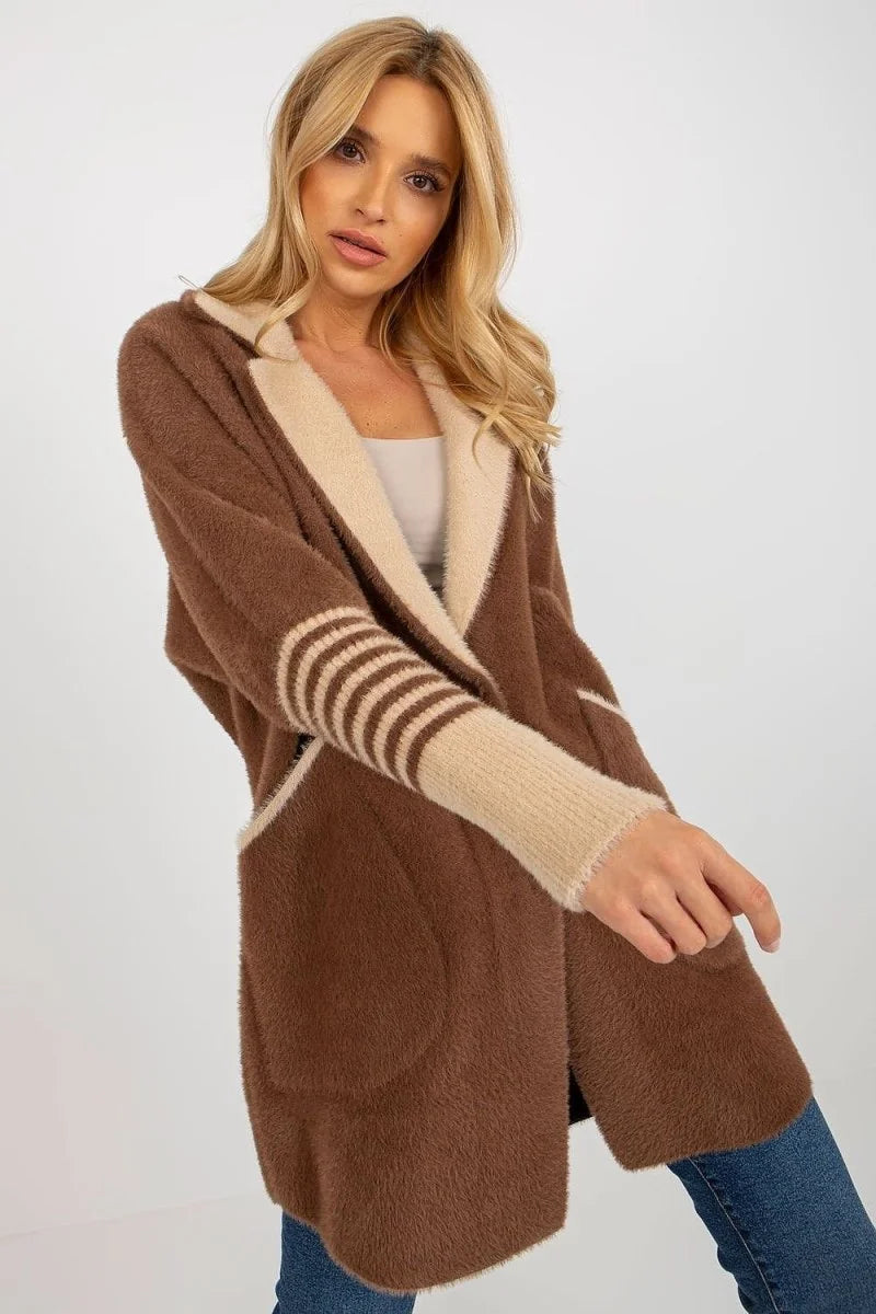 Fluffy brown cardigan with beige trim and striped sleeves on a model.