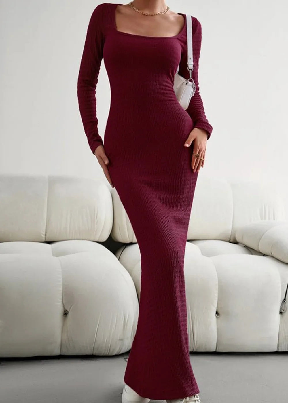 Maroon ribbed knit maxi dress with a square neckline and long sleeves, worn by a model.
