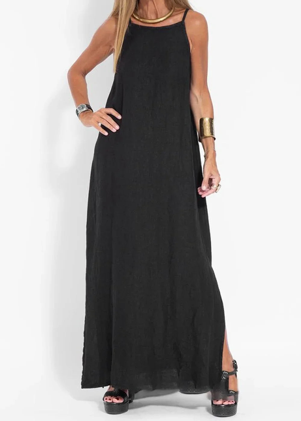 Black linen-blend maxi dress with side slits and platform sandals on model.