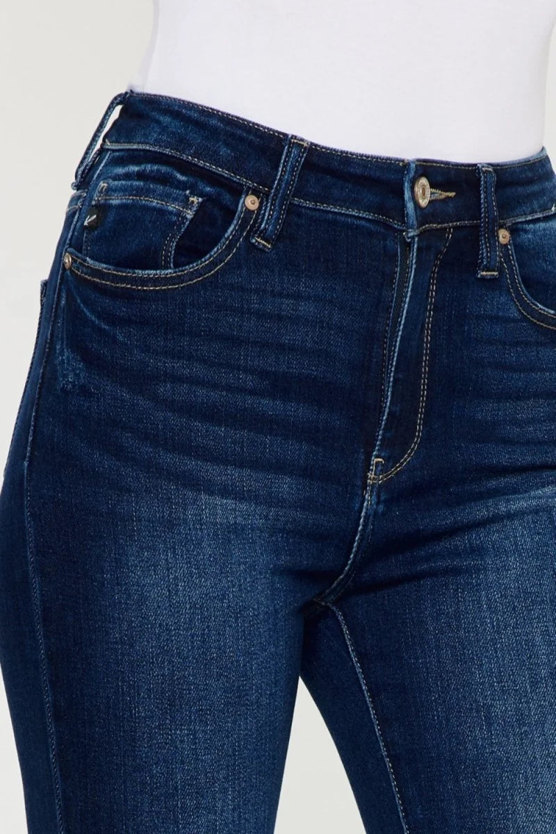 Dark wash, slightly stretchy denim jeans with a button and zipper closure, featuring classic five-pocket styling.