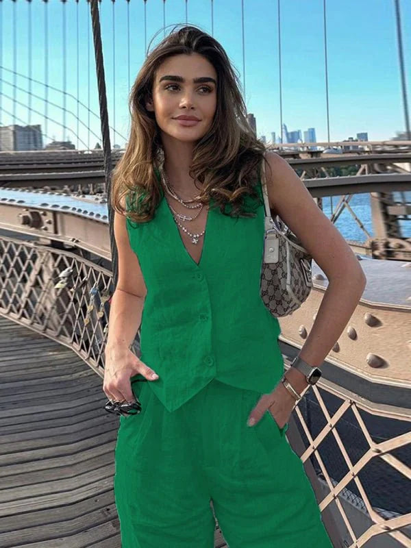 Green linen vest and pants set on a model, with a textured fabric and regular fit.