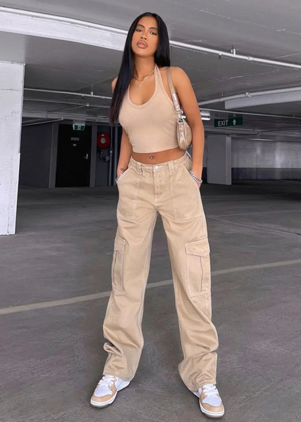 Tan cargo pants with a regular fit, featuring multiple pockets and a chain detail at the waist.