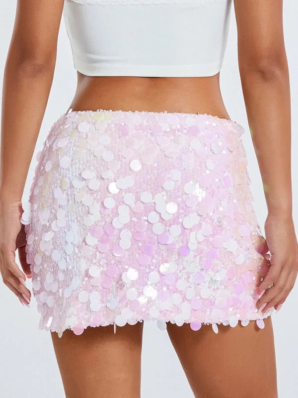 Pink sequin mini skirt with iridescent shimmer, on model.