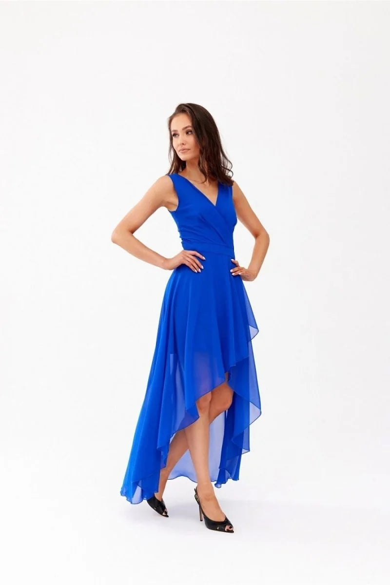 Model in a vibrant royal blue asymmetrical chiffon dress with a V-neck and flowing skirt.