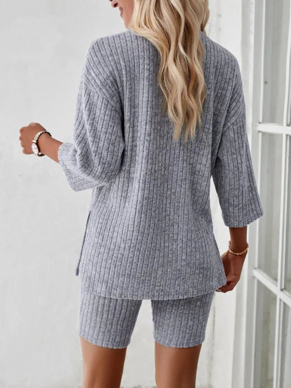 Grey ribbed knit short suit with a relaxed fit, showing the back of the top and shorts on a model.