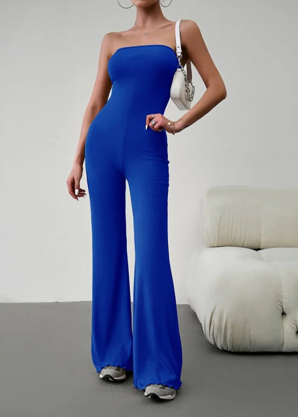 Royal blue strapless wide-leg jumpsuit with a fitted bodice and flared legs.