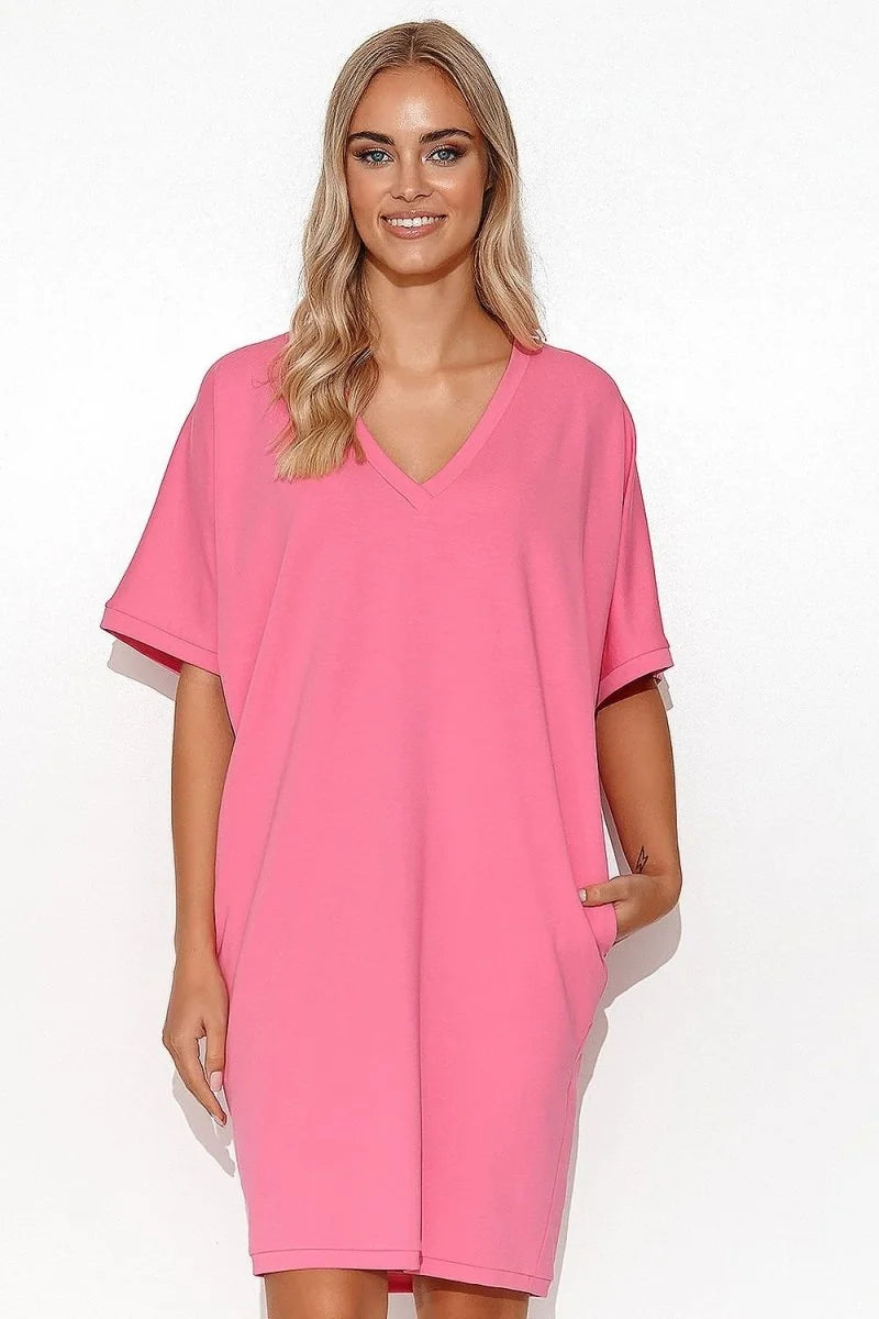 Bright pink cotton-spandex v-neck dress with short sleeves and pockets, on a white background.
