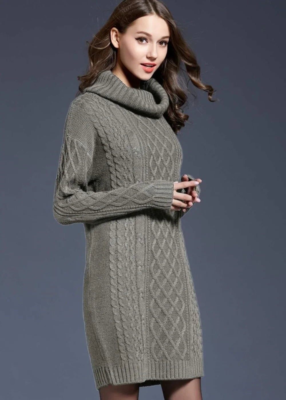 Gray cable knit turtleneck sweater dress with long sleeves on a model.