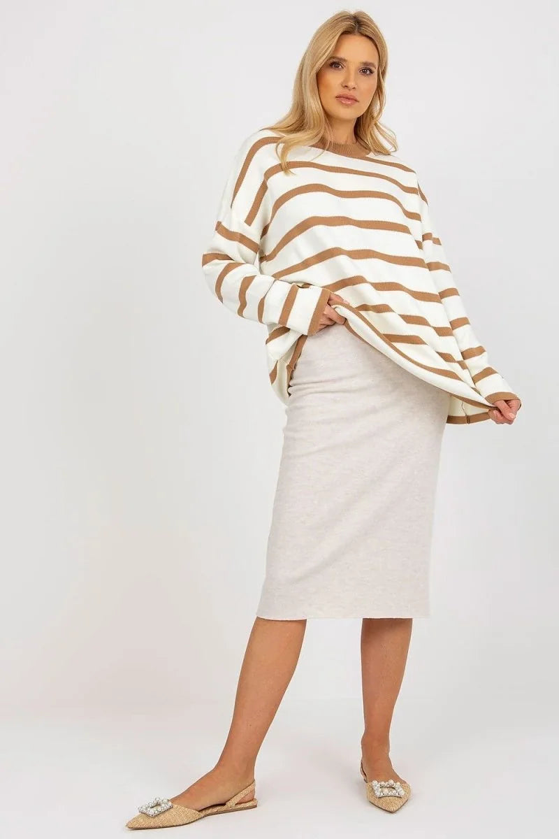 Relaxed fit white and brown striped sweater with a light beige pencil skirt and embellished flats.