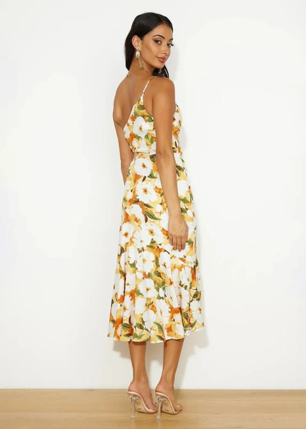 Yellow and white floral print midi dress with a ruffled hem, worn by a model.