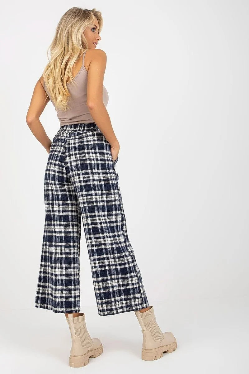 Navy and white checkered culottes made of wool blend, on model