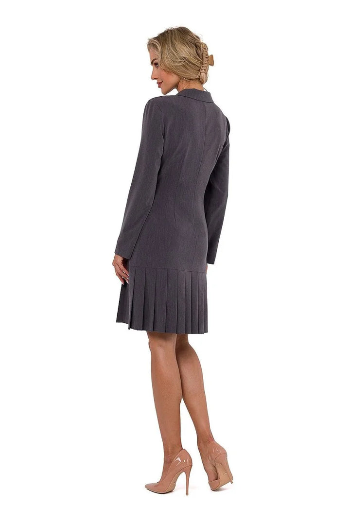 Gray pleated blazer dress with long sleeves, shown from the back on a model.