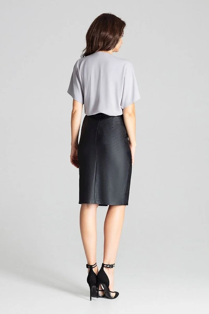 Black faux leather pencil skirt with a high waist and ankle strap heels.