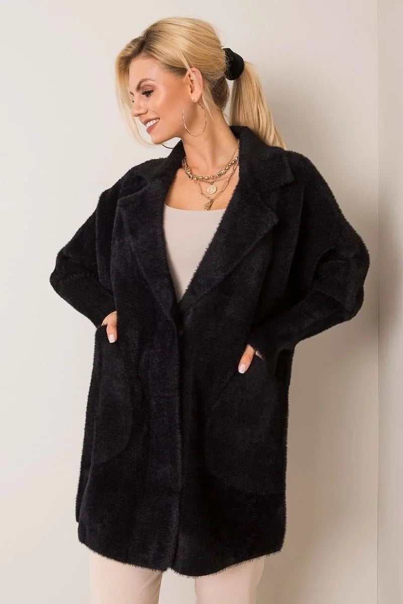 Black fuzzy angora blend jacket with lapels and pockets on a model.
