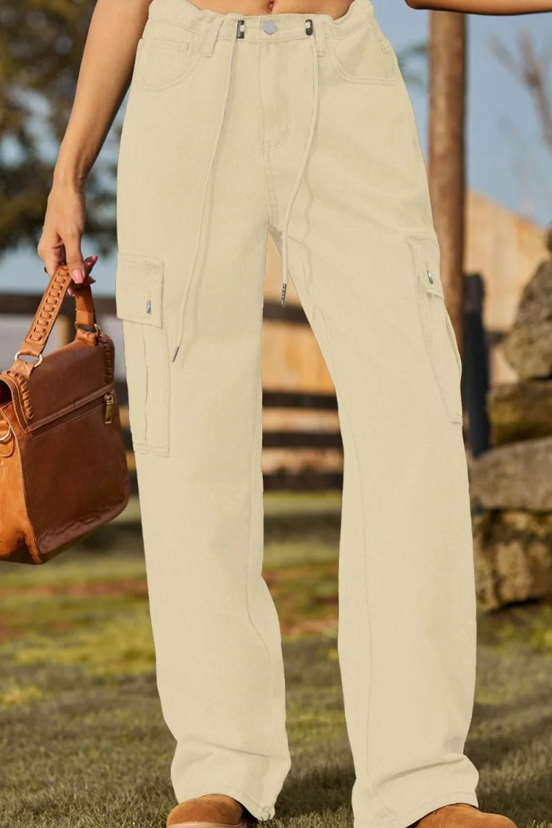 Light beige cargo pants with drawstring waist, side pockets, and a regular fit.