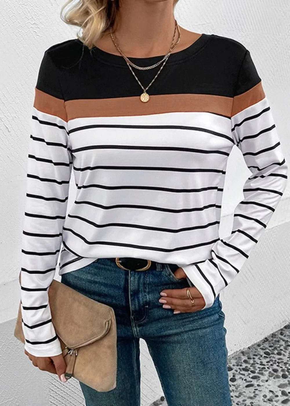 Long-sleeve striped top with black, brown, and white horizontal stripes.