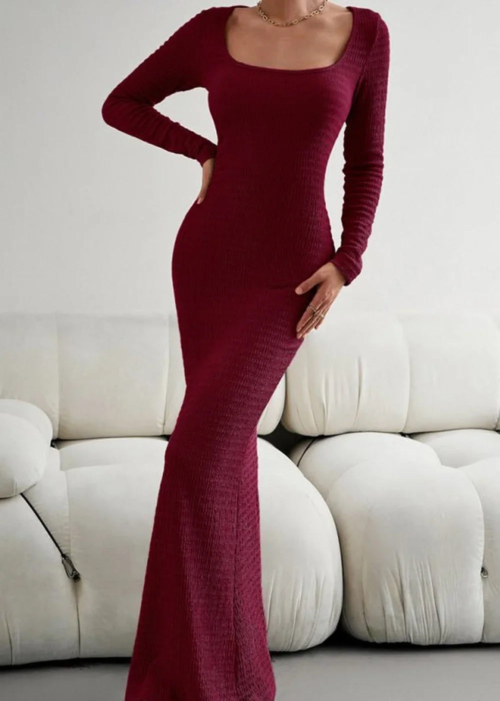 Burgundy ribbed maxi dress with long sleeves and a square neckline, fitted silhouette.