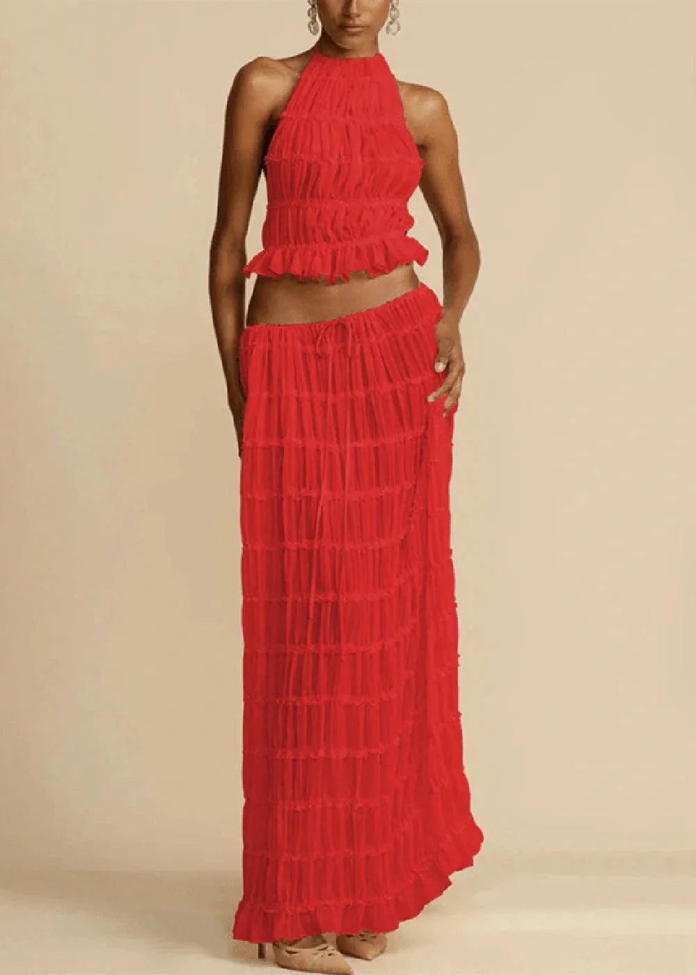 Red ruffled halter crop top and matching tiered maxi skirt with drawstring waist.
