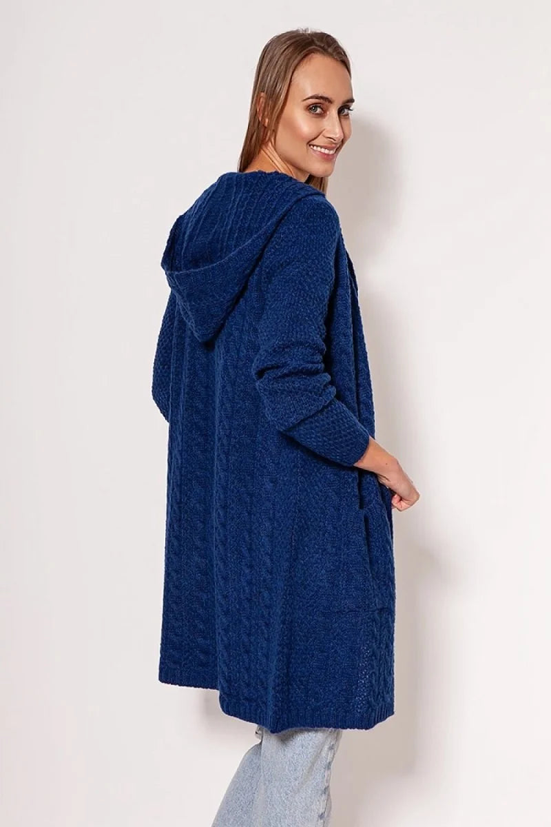 Navy blue hooded cardigan with cable knit texture and side pockets on model.