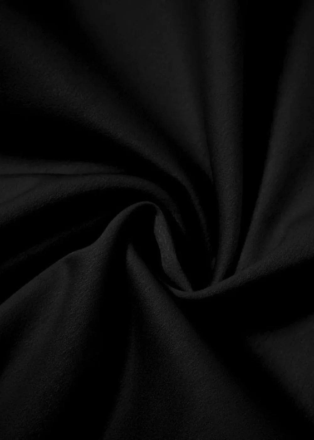 Close-up of black polyester fabric with subtle texture and soft folds.