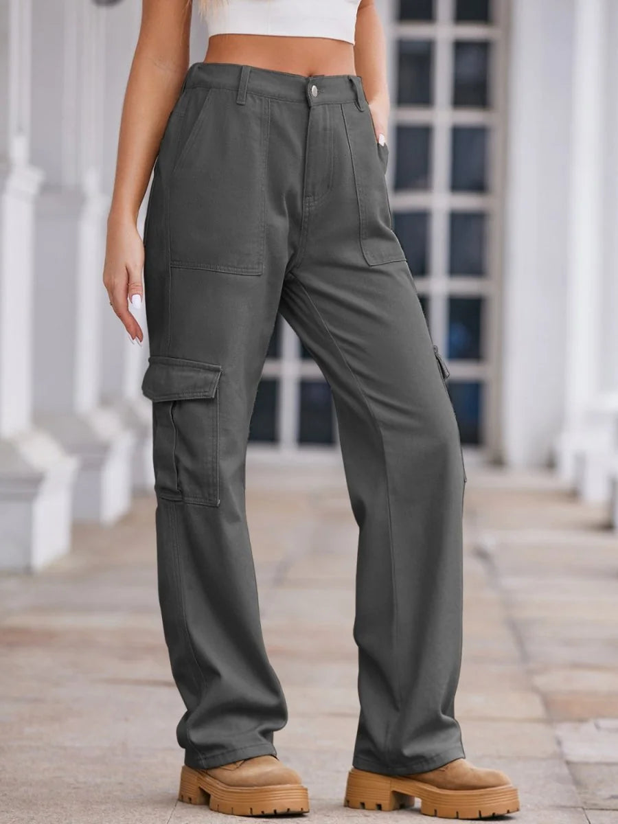 Dark gray cargo pants with a regular fit, featuring multiple pockets and a casual style on model.
