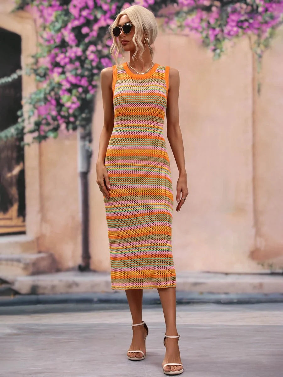 Striped knit midi dress in orange, pink, and green with a crochet texture, on a model.