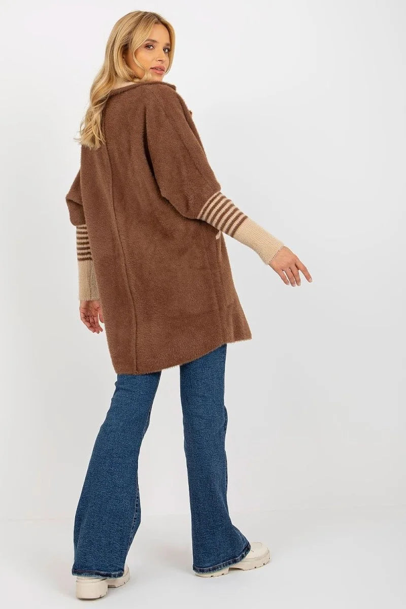 Brown angora blend cardigan with striped sleeves on a model wearing flared jeans.